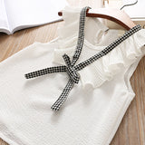 Ju Ju Jam girl's two-piece plaid set, featuring a stylish plaid design with a coordinating top and bottoms for a fashionable and coordinated look.