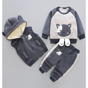 Cozy three-piece winter outfit for boys and girls, including a jacket, pants, and inner top, perfect for cold weather, available at Ju Ju Jam.