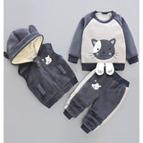 Cozy three-piece winter outfit for boys and girls, including a jacket, pants, and inner top, perfect for cold weather, available at Ju Ju Jam.