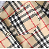 Trendy Little Man's Hooded Plaid Shirt for boys and girls, featuring a comfy hood and classic plaid design, perfect for casual wear at Ju Ju Jam.