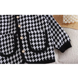 Ju Ju Jam Girls Smart Checkered Cardigan, offering a sophisticated checkered design and warmth for cooler days.