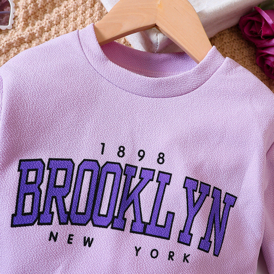 Kids' fashion: Ju Ju Jam's Purple Pleated Skirt and Sweatshirt ensemble