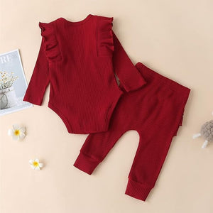 Ju Ju Jam's cozy ribbed romper and headband set for baby girls, featuring a soft texture and cute, coordinated look.