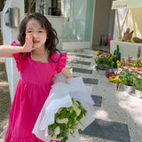 Korean-inspired girls’ party dress with a beautiful back bow, designed for baby girls - Available at Ju Ju Jam.