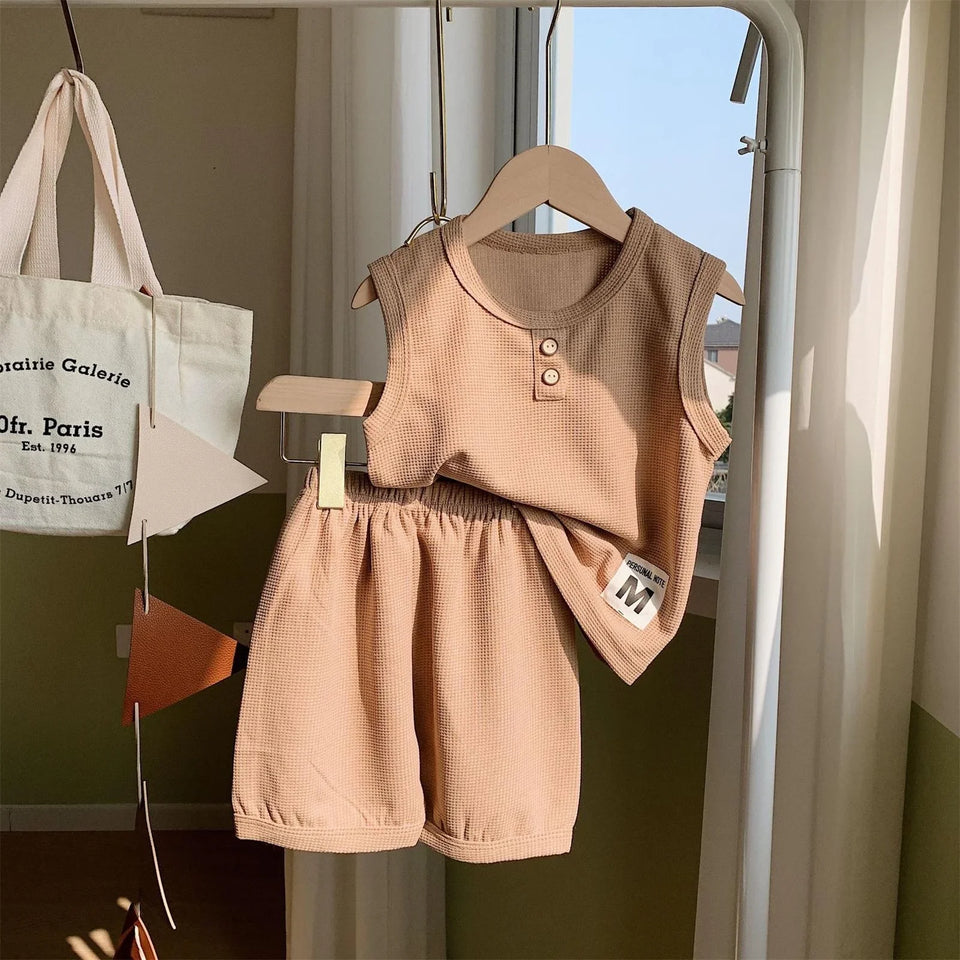 Beige Sleeveless Boys Clothing Set - Stylish and comfortable outfit featuring a sleeveless top and matching shorts in a neutral beige color, perfect for warm-weather wear, available at Ju Ju Jam.