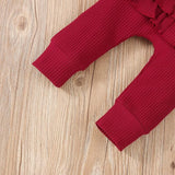 Ju Ju Jam's ribbed baby girls romper with matching headband, designed for cozy warmth and adorable style.