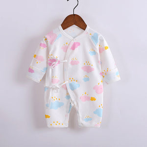 Baby boy and girl in a Dreamy Clouds romper from Ju Ju Jam.