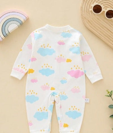 Infant dressed in a Dreamy Clouds romper, perfect for both boys and girls from Ju Ju Jam.