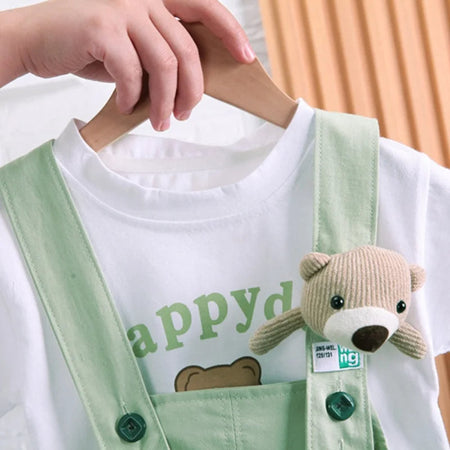 Infant dressed in a Happy Day Bear Hanging jumpsuit, designed for both boys and girls from Ju Ju Jam