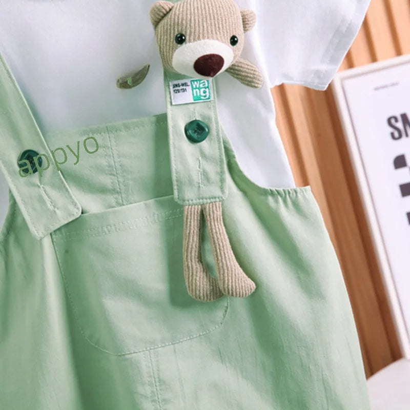 Infant dressed in a Happy Day Bear Hanging jumpsuit, designed for both boys and girls from Ju Ju Jam