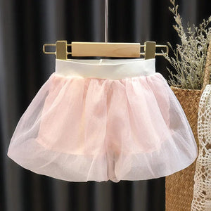 Blush Baby Girls Collared Top by Ju Ju Jam laid flat, emphasizing its soft pastel fabric and elegant structure.