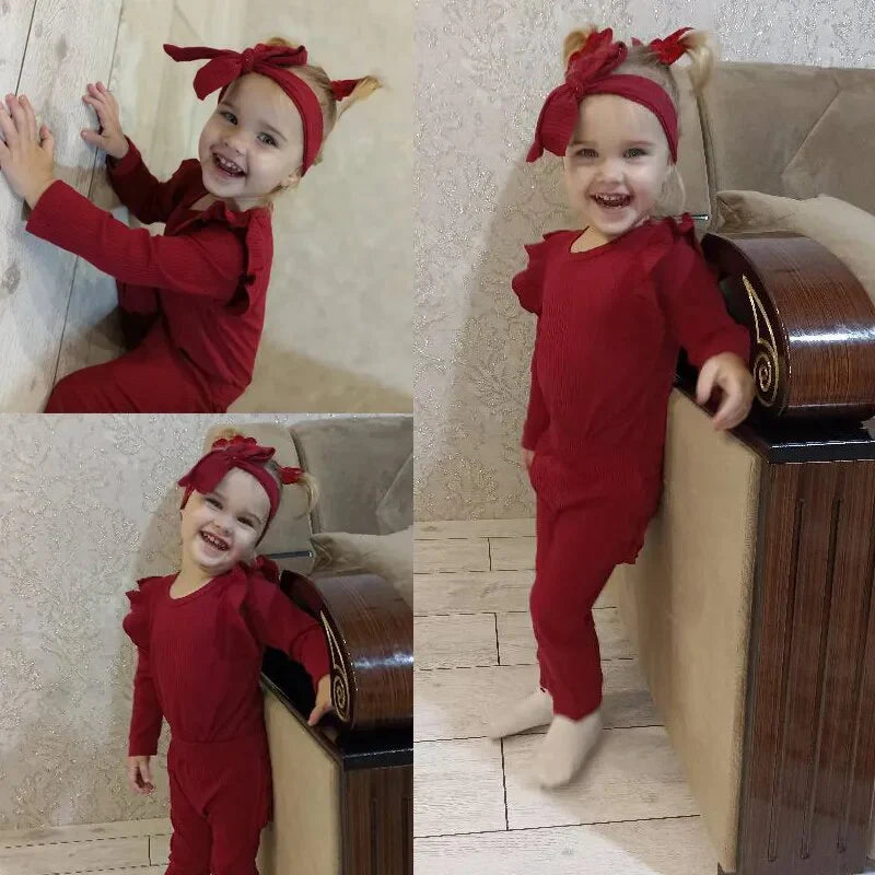Adorable ribbed baby girls romper and headband set by Ju Ju Jam, offering both warmth and style for little ones.
