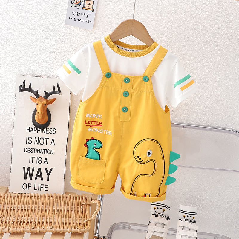 Baby boy and girl in a Little Dino Monster jumpsuit from Ju Ju Jam.