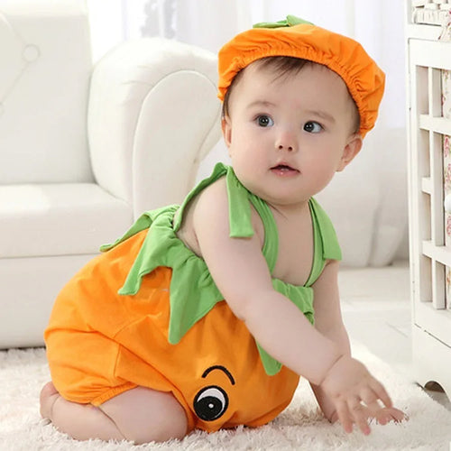 Baby girl in a Little Pumpkin romper with a matching cap from Ju Ju Jam.