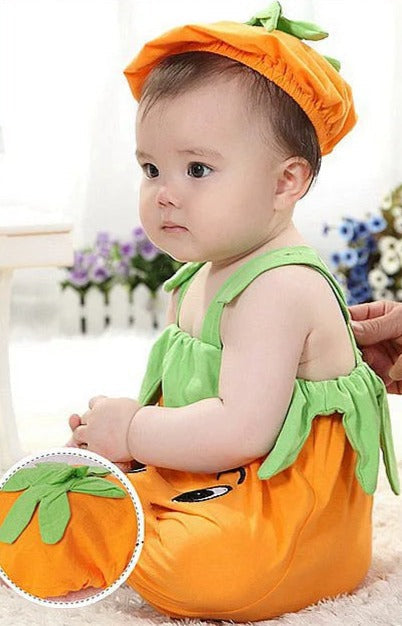 Sweet baby girl in a Little Pumpkin romper with cap, combining fun and coziness from Ju Ju Jam."