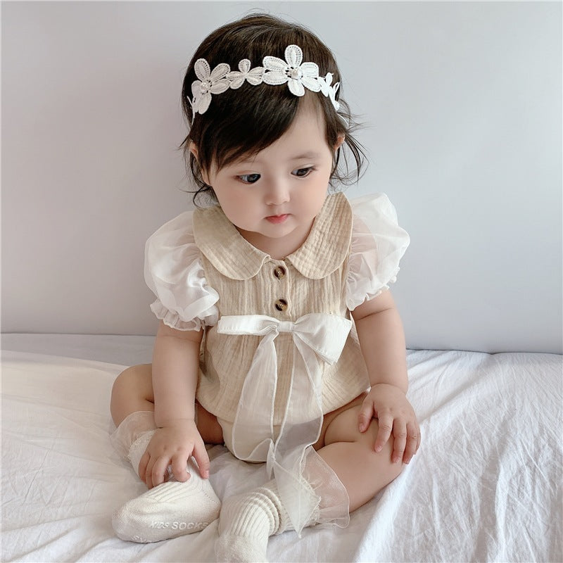 Baby girl in a My Lady bow romper from Ju Ju Jam.