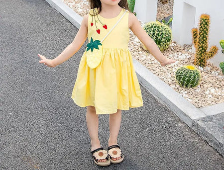 Close-up of pineapple print and sling straps on girls' dress - Ju Ju Jam