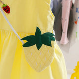 Close-up of pineapple print and sling straps on girls' dress - Ju Ju Jam