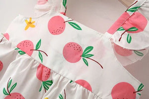 Close-up of bow detail on pink baby girls' dress with hat - Ju Ju Jam