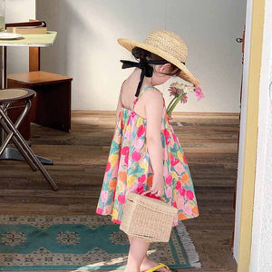 Charming Pink Floral Dress for Girls - Features a vibrant floral pattern in pink, ideal for vacations and sunny days, at Ju Ju Jam.