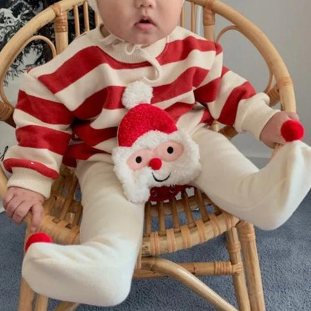 Santa-inspired romper with matching cap for baby girls and boys, holiday collection by Ju Ju Jam.