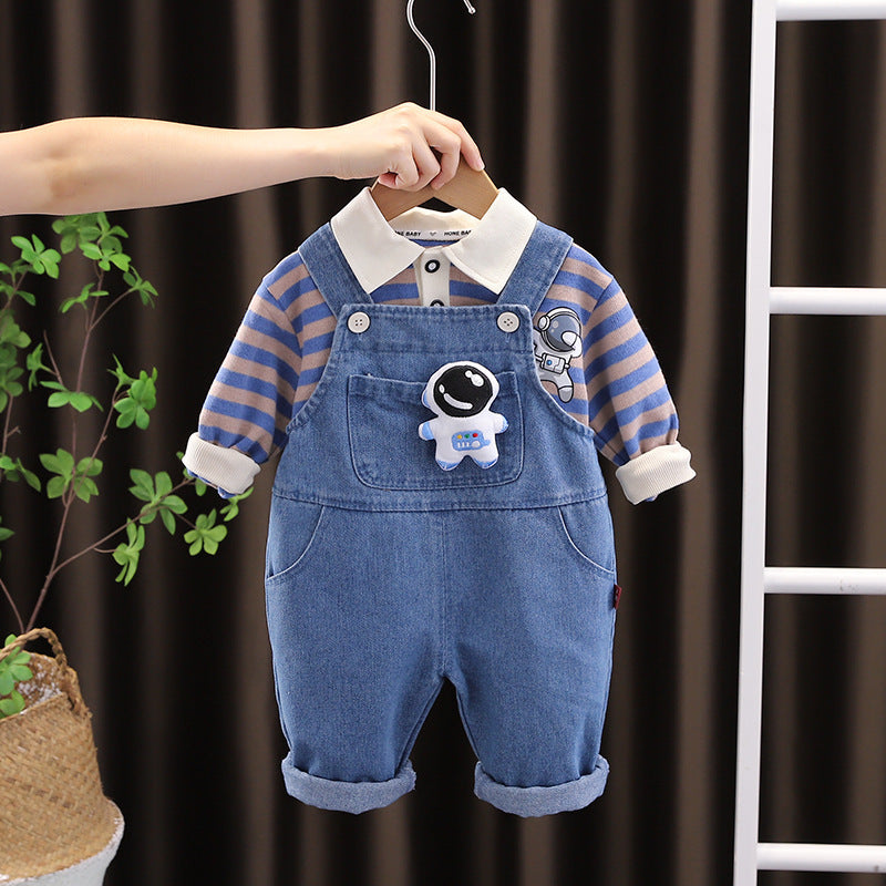 Baby boy in a Striped T-shirt paired with an Astronaut-themed jumpsuit from Ju Ju Jam.