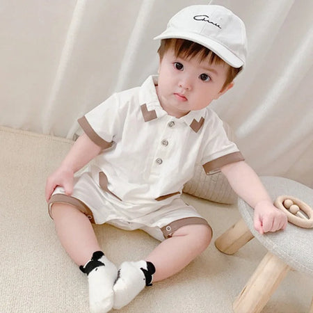 Elegant White Collared romper for baby boys, combining style and comfort from Ju Ju Jam