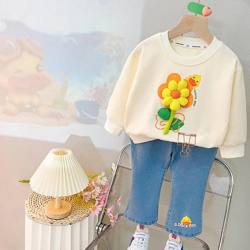 Ju Ju Jam girls' sweatshirt with 3D flower design paired with denim bottoms