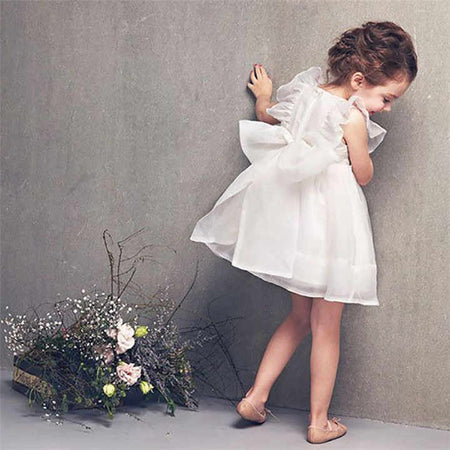 Girls' mesh dress with a lovely back bowknot by Ju Ju Jam, combining comfort and charm for your little one.